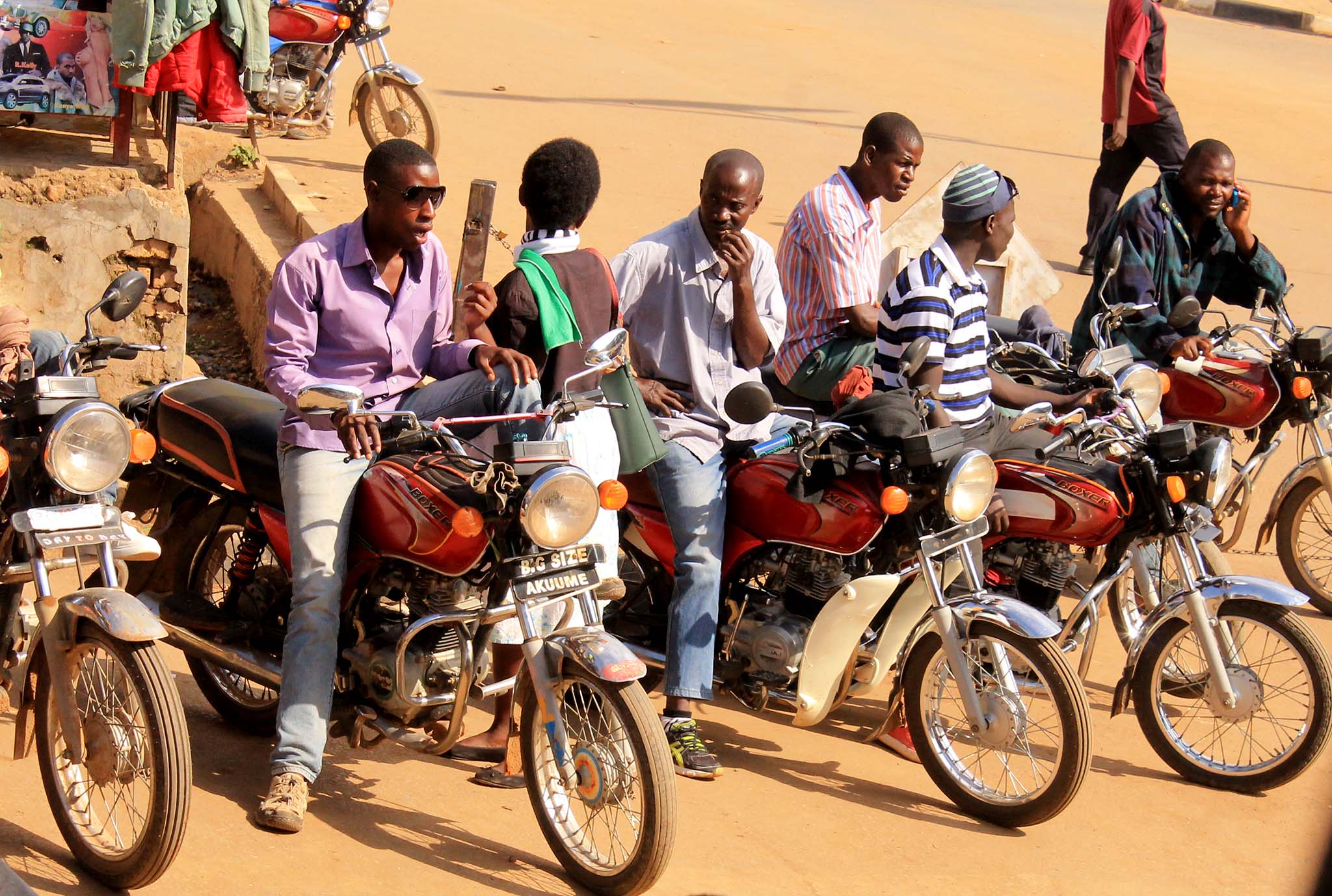 group of motorcycle drivers in front of building