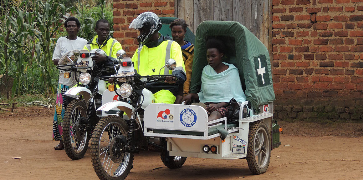 woman in a motorcycle cartdriving to clinic